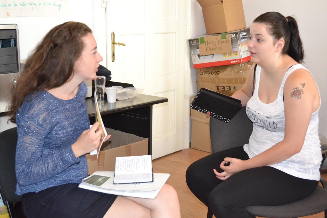 Teenage volunteer chat with each other about different interview techniques during their Journalism Project Journalism volunteers practice their interviewing skills as part of their project in Romania